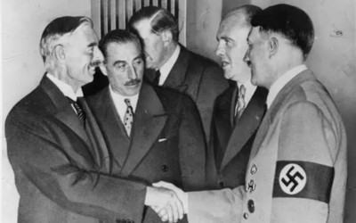 Illustrative: Neville Chamberlain, left, and Hitler sealing the Munich pact in September 1938. (Public Domain)