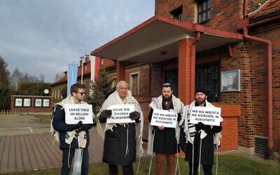 From left to right, rabbis Shabbos Kestenbaum, Avi Weiss, Ezra Seligsohn, and Jonathan Leener protest the location of a church in a former SS headquarters across from the former Nazi death camp Birkenau, January 27, 2020. (Yaakov Schwartz/ Times of Israel)