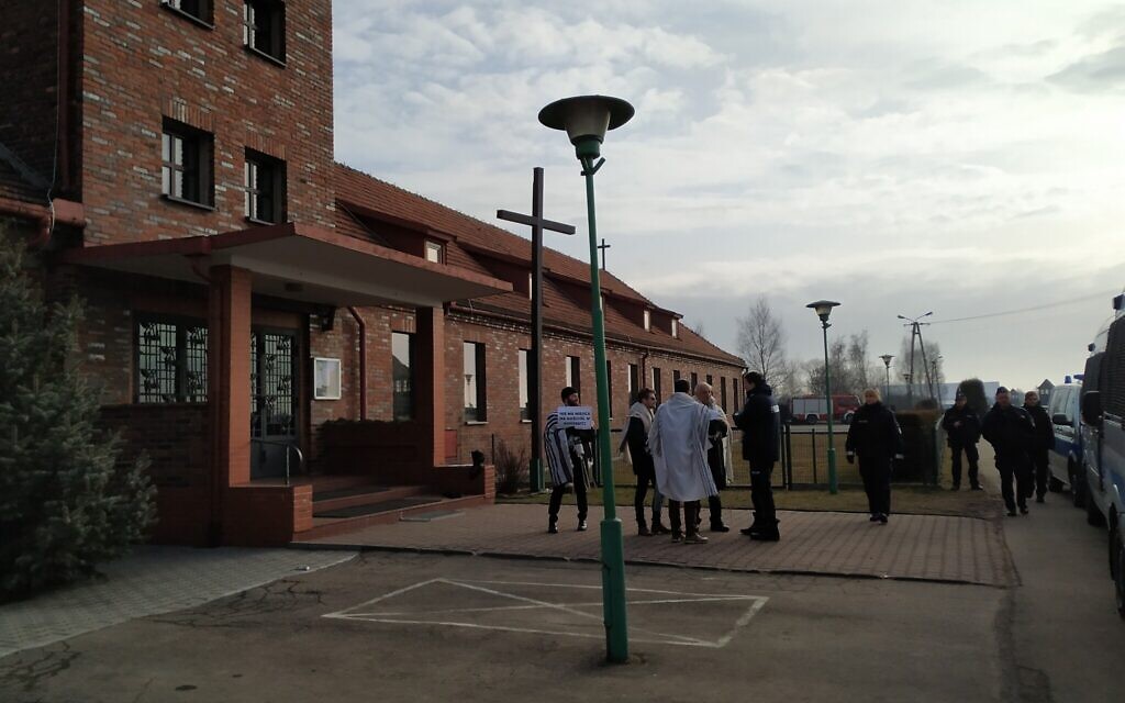 Rabbis Shabbos Kestenbaum, Avi Weiss, Ezra Seligsohn, and Jonathan Leener protest the location of a church in a former SS headquarters across from the former Nazi death camp Birkenau, January 27, 2020. (Yaakov Schwartz/ Times of Israel)