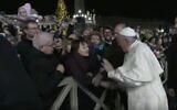 Pope Francis slaps the hand of a woman who grabbed at him during a New Year's appearance at the Vatican in Rome on December 31, 2019. (Screengrab)