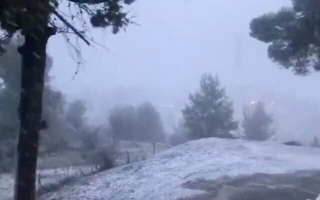 Screen capture from video of snow falling the northern city of Safed, January 21, 2020. (Twitter) Screen capture from video of snow falling the northern city of Safed, January 21, 2020. (Twitter)