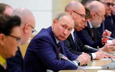 Russian President Vladimir Putin attends a meeting on drafting constitutional changes at the Novo-Ogaryovo residence outside Moscow, Russia, January 16, 2020. (Mikhail Klimentyev, Sputnik, Kremlin Pool Photo via AP)