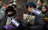 Mourners attend a symbolic 'March of the Living' at the Paneriai memorial, in memory of Lithuanian Jews killed by Nazis during World War II, in Vilnius, Lithuania, April 26, 2017. (AP Photo/Mindaugas Kulbis)