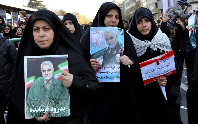 Mourners holding posters of Iranian general Qassem Soleimani attend a funeral ceremony in Tehran, Iran, January 6, 2020. (AP Photo/Ebrahim Noroozi) Mourners holding posters of Iranian general Qassem Soleimani attend a funeral ceremony in Tehran, Iran, January 6, 2020. (AP Photo/Ebrahim Noroozi)