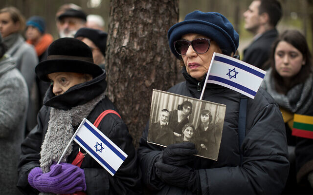 Mourners attend a symbolic 'March of the Living' at the Paneriai memorial, in memory of Lithuanian Jews killed by Nazis during World War II, in Vilnius, Lithuania, April 26, 2017. (AP Photo/Mindaugas Kulbis) Mourners attend a symbolic 'March of the Living' at the Paneriai memorial, in memory of Lithuanian Jews killed by Nazis during World War II, in Vilnius, Lithuania, April 26, 2017. (AP Photo/Mindaugas Kulbis)