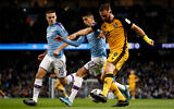 Port Vale's Tom Pope, right, during a soccer match in Manchester, England, January 4, 2020. (Martin Rickett/PA via AP)