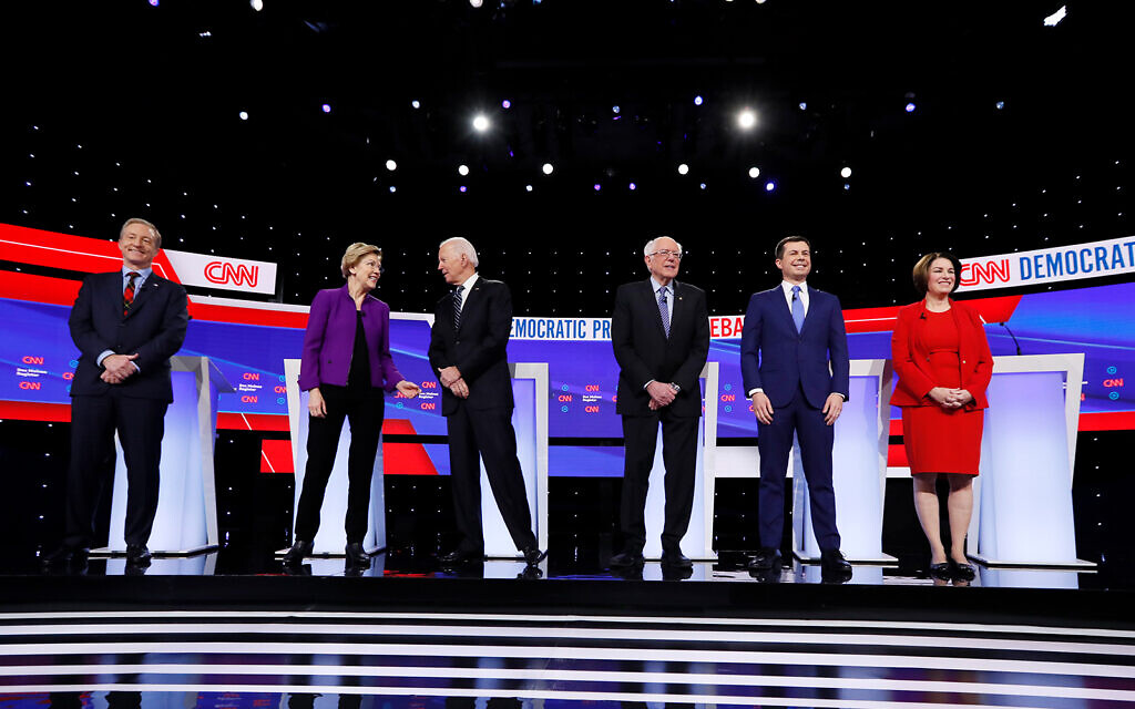 From left, Democratic presidential candidates Tom Steyer, Sen. Elizabeth Warren, D-Mass., former Vice President Joe Biden, Sen. Bernie Sanders, I-Vt., former South Bend Mayor Pete Buttigieg, and Sen. Amy Klobuchar, D-Minn., stand on stage, January 14, 2020, before a Democratic presidential primary debate in Des Moines, Iowa. (AP Photo/Charlie Neibergall) From left, Democratic presidential candidates Tom Steyer, Sen. Elizabeth Warren, D-Mass., former Vice President Joe Biden, Sen. Bernie Sanders, I-Vt., former South Bend Mayor Pete Buttigieg, and Sen. Amy Klobuchar, D-Minn., stand on stage, January 14, 2020, before a Democratic presidential primary debate in Des Moines, Iowa. (AP Photo/Charlie Neibergall)
