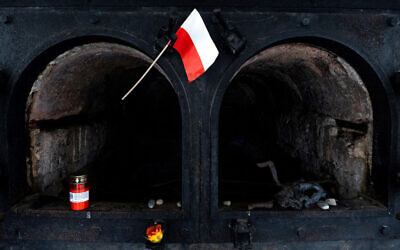 A Polish flag displayed in front of a former crematorium oven at the Gusen concentration camp in Austria, January 20, 2020. (Joe Klamar/AFP)