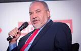 Yisrael Beytenu party chief Avigdor Liberman attends a Tel Aviv conference, December 31, 2019. (Miriam Alster/Flash90)