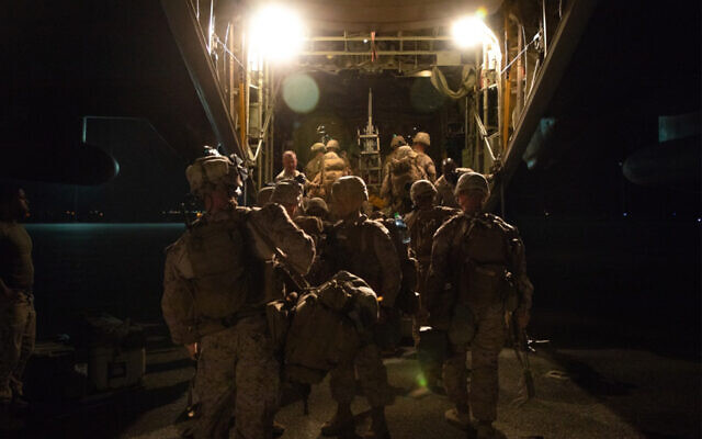 US Marines load a C-130 plane to reinforce the Baghdad Embassy Compound in Iraq, Dec. 31, 2019. (US Marine Corps/Sgt. Kyle C. Talbot) US Marines load a C-130 plane to reinforce the Baghdad Embassy Compound in Iraq, Dec. 31, 2019. (US Marine Corps/Sgt. Kyle C. Talbot)