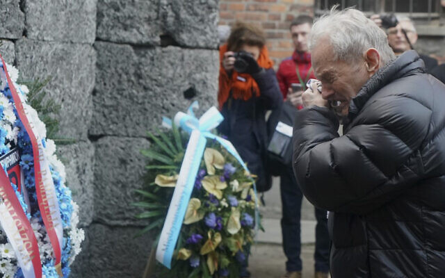 A Holocaust survivor cries as he pays his respect at the death wall at the memorial site of the former German Nazi death camp Auschwitz during ceremonies to commemorate the 75th anniversary of the camp's liberation in Oswiecim, Poland, January 27, 2020. (JANEK SKARZYNSKI/AFP) A Holocaust survivor cries as he pays his respect at the death wall at the memorial site of the former German Nazi death camp Auschwitz during ceremonies to commemorate the 75th anniversary of the camp's liberation in Oswiecim, Poland, January 27, 2020. (JANEK SKARZYNSKI/AFP)