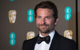 Bradley Cooper poses for photographers upon arrival at the BAFTA Film Awards in London, Feb. 10, 2019. (Vianney Le Caer/Invision/AP)