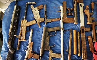 Guns and other weapons seized by Israeli security forces in the West Bank over the past month and a half, in a photograph shared by the military on January 21, 2020. (Israel Defense Forces)