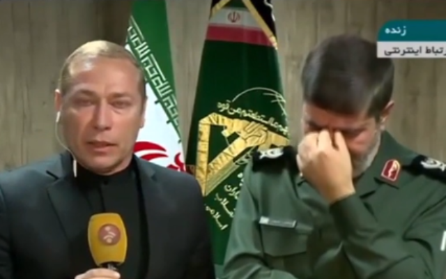 A spokesman for Iran's Revolutionary Guards (right) is seen weeping after announcing the death of top general Qassem Soleimani, January 3, 2020 (MEMRI screenshot) A spokesman for Iran's Revolutionary Guards (right) is seen weeping after announcing the death of top general Qassem Soleimani, January 3, 2020 (MEMRI screenshot)