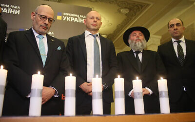 Israeli Ambassador to Ukraine Joel Lion, left, and other dignitaries commemorate the Holocaust at the Ukrainian parliament, January 16, 2020. (The Assembly of Nationalities of Ukraine via JTA)