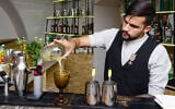 A bartender prepares a cocktail at Kosher Bar in Odessa, Ukraine, Sept. 25, 2019. (Courtesy of Kosher Bar via JTA)