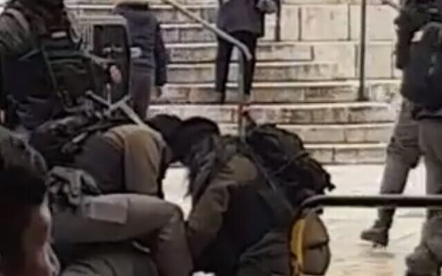 Border Police officers restrain a woman said to have attempted to carry out a stabbing attack at Jerusalem Old City's Damascus Gate, January 18, 2020 (Screen grab via Twitter) Border Police officers restrain a woman said to have attempted to carry out a stabbing attack at Jerusalem Old City's Damascus Gate, January 18, 2020 (Screen grab via Twitter)
