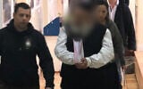 The alleged leader of a cult of dozens of women and young children is brought to a court in Jerusalem, January 13, 2020 (Channel 12 news)