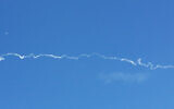 A white trail left behind by a rocket test by the Defense Ministry over central Israel on January 31, 2020. (Screen capture)