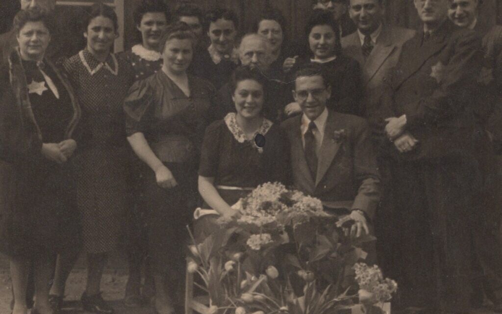 Newlywed couple Eddy and Friedel de Wind, seated, after their marriage ceremony at the Dutch transit camp Westerbork, March 1943 (courtesy: Melcher de Wind)