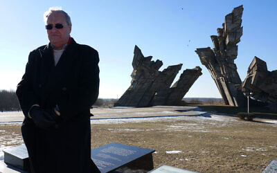 File: Nazi-hunter Efraim Zuroff saying Kaddish, a mourning prayer, for Holocaust victims near Kaunas, Lithuania, Feb. 15, 2015. (Cnaan Liphshiz/JTA)