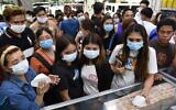 People buying protective masks at a medical supplies store in Manila, Philippines on January 31, 2020. (Ted Aljibe/AFP)
