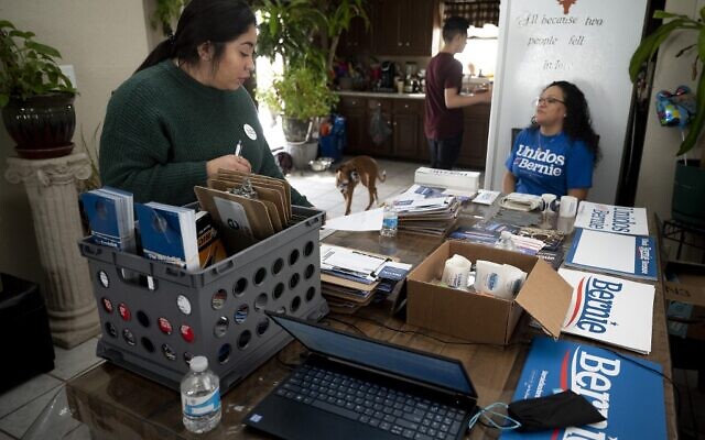 Latinx, a Latin American community outreach organization, and Democratic presidential candidate Bernie Sanders organizer Candy Alfaro (L) readies canvassing equipment with Spanish Satellite Captain Rosa Salazar (R) in Muscatine, Iowa on February 1, 2020. (Jim Watson/AFP) Latinx, a Latin American community outreach organization, and Democratic presidential candidate Bernie Sanders organizer Candy Alfaro (L) readies canvassing equipment with Spanish Satellite Captain Rosa Salazar (R) in Muscatine, Iowa on February 1, 2020. (Jim Watson/AFP)