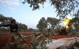 A Syrian rebel fighter fires a cannon amid clashes with government forces in the last major rebel bastion of Idlib in northwestern Syria on February 6, 2020. (Omar HAJ KADOUR / AFP)