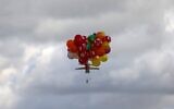 Balloons carrying an incendiary device floats after being released near Gaza's Bureij refugee camp, along the Israel-Gaza border fence, on February 10, 2020. (MAHMUD HAMS / AFP)
