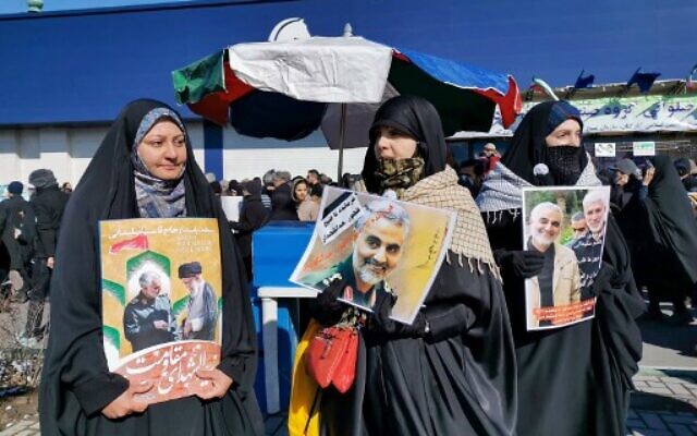 Iranian women carry a portrait of slain Iranian General Qasem Soleimani, on the 40th day of his killing in a US drone strike, during commemorations marking 41 years since the Islamic Revolution, in the capital Tehran on February 11, 2020 (Atta KENARE / AFP) Iranian women carry a portrait of slain Iranian General Qasem Soleimani, on the 40th day of his killing in a US drone strike, during commemorations marking 41 years since the Islamic Revolution, in the capital Tehran on February 11, 2020 (Atta KENARE / AFP)