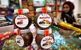 Jars of a Gazan version of a world famous spread, dubbed 'Natalia' are displayed on a shop counter in Gaza city on February 12, 2020. (Photo by MOHAMMED ABED / AFP)