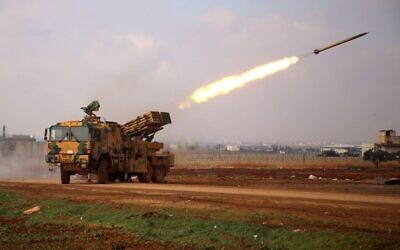 A Turkish mobile rocket launcher fires from a position near the village of Miznaz, on the western outskirts of Syria's Aleppo province, on February 14, 2020. (Aaref Watad/AFP)
