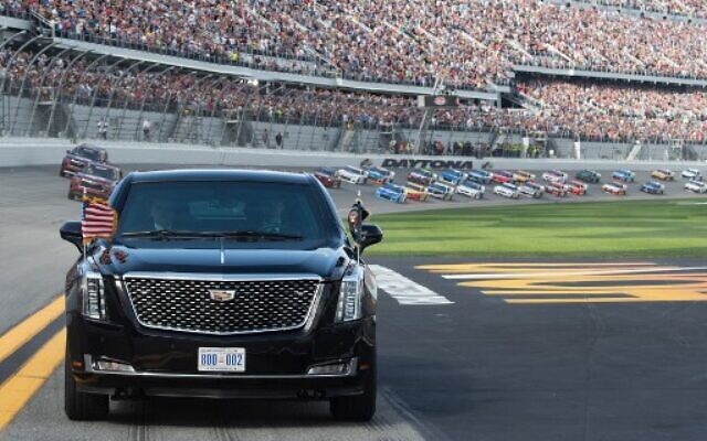 US President Donald Trump and First Lady Melania Trump ride in the Presidential limousine as they take a pace lap ahead of the start of the Daytona 500 Nascar race at Daytona International Speedway in Daytona Beach, Florida, February 16, 2020. (Photo by SAUL LOEB / POOL / AFP) US President Donald Trump and First Lady Melania Trump ride in the Presidential limousine as they take a pace lap ahead of the start of the Daytona 500 Nascar race at Daytona International Speedway in Daytona Beach, Florida, February 16, 2020. (Photo by SAUL LOEB / POOL / AFP)