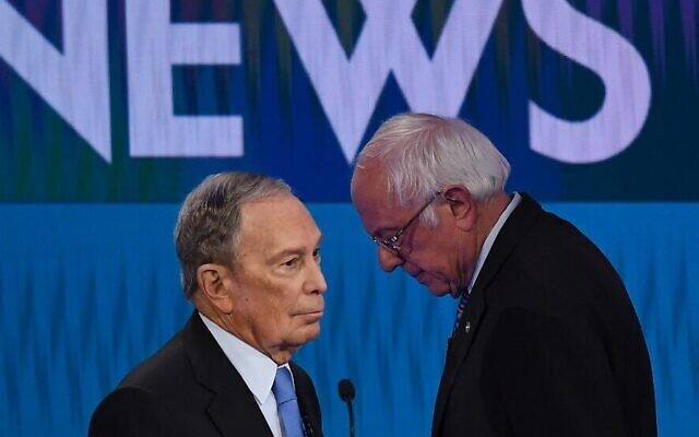 Democratic presidential hopefuls former New York Mayor Mike Bloomberg (L) and Vermont Senator Bernie Sanders (R) speak during a break in the ninth Democratic primary debate of the 2020 presidential campaign season in Las Vegas, Nevada, on February 19, 2020. (Mark Ralston/AFP)