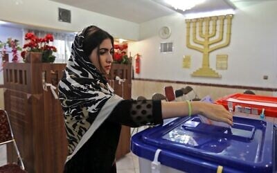 A Jewish Iranian woman casts her ballot at a polling station in the capital Tehran on February 21, 2020. (Atta Kenare/AFP)
