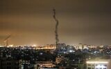 The smoke trail of a rocket, fired by Palestinian terrorists, flying over the Gaza Strip, on February 23, 2020. (Mahmud Hams/AFP)
