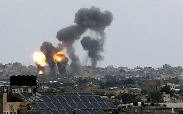 Fireballs and smoke rise into the air following an Israeli air strike in Khan Yunis in the southern Gaza Strip in response to rocket attacks by the Palestinian Islamic Jihad terror group throughout the day on February 24, 2020. (SAID KHATIB / AFP) Fireballs and smoke rise into the air following an Israeli air strike in Khan Yunis in the southern Gaza Strip in response to rocket attacks by the Palestinian Islamic Jihad terror group throughout the day on February 24, 2020. (SAID KHATIB / AFP)