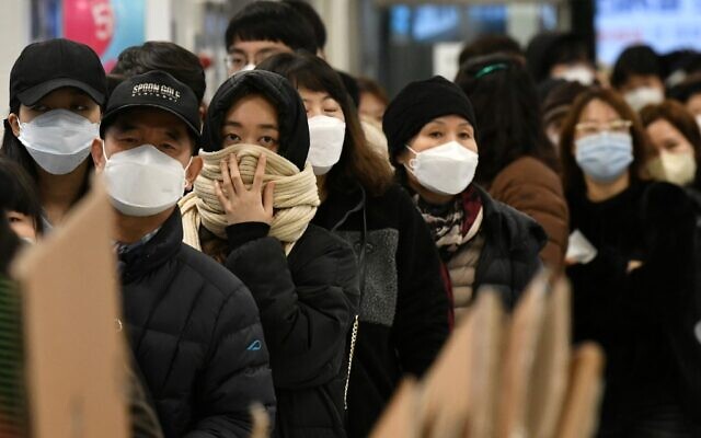 People wait in a line to buy face masks at a retail store in the southeastern city of Daegu on February 25, 2020. (Jung Yeon-je / AFP) People wait in a line to buy face masks at a retail store in the southeastern city of Daegu on February 25, 2020. (Jung Yeon-je / AFP)