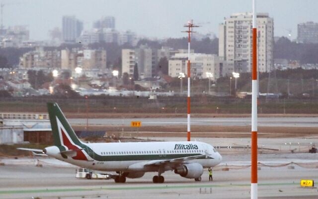 An Alitalia plane is seen parked on the tarmac at Ben Gurion International Airport on February 27, 2020, after passengers traveling from Italy were denied entry to Israel. (Jack Guez/AFP)