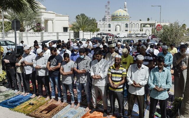 Muslim worshippers, some wearing protective masks, perform together Friday prayers outside a mosque in Bahrain's capital Manama on February 28, 2020. (Mazen Mahdi/AFP) Muslim worshippers, some wearing protective masks, perform together Friday prayers outside a mosque in Bahrain's capital Manama on February 28, 2020. (Mazen Mahdi/AFP)
