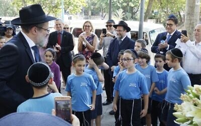 Members of the Chabad Hasidic community in Rio de Janeiro attend the naming of a square in the city's upscale Leblon neighborhood for the late Lubavitcher Rebbe, on February 19, 2020. (Courtesy Israeli honorary consulate in Rio)