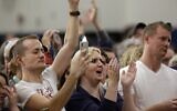 Attendees cheer as they listen to Democratic presidential candidate former vice president Joe Biden during a campaign event at Hiatt Middle School in Des Moines, Iowa, on February 2, 2020. (Joshua Lott/Getty Images/AFP)