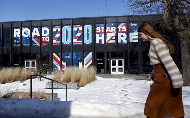A woman walks past a sign displayed on a building at Drake University that reads "Road To 2020 Starts Here" on February 2, 2020 in Des Moines, Iowa. (Joshua Lott/Getty Images/AFP) A woman walks past a sign displayed on a building at Drake University that reads "Road To 2020 Starts Here" on February 2, 2020 in Des Moines, Iowa. (Joshua Lott/Getty Images/AFP)