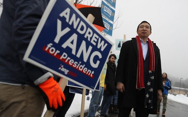 Democratic presidential candidate Andrew Yang greets supporters holding signs in front of a polling station on February 11, 2020 in Keene, New Hampshire. (Justin Sullivan/Getty Images/AFP) Democratic presidential candidate Andrew Yang greets supporters holding signs in front of a polling station on February 11, 2020 in Keene, New Hampshire. (Justin Sullivan/Getty Images/AFP)