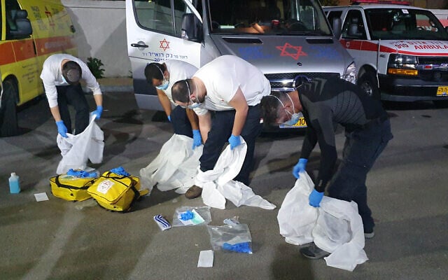 Magen David Adom personnel donning protective gear at Ben-Gurion Airport on February 21, 2020. (Courtesy MDA) Magen David Adom personnel donning protective gear at Ben-Gurion Airport on February 21, 2020. (Courtesy MDA)