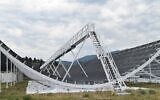 Wire-mesh half pipe reflector of the Canadian Hydrogen Intensity Mapping Experiment (CHIME) telescope reflects feeds radio signals to the telescope’s antennas located at the focus line at the center of the half pipe (Wikimedia/Creative Commons)