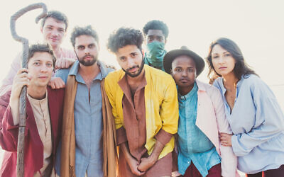 Sammy Miller, center, in yellow, and his band the Congregation. (Lauren Desberg via JTA)