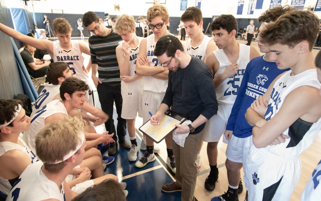 Coach Ben Falk provides instruction to his Barrack Hebrew Academy basketball team. (Jay Gorodetzer Photography/via JTA) Coach Ben Falk provides instruction to his Barrack Hebrew Academy basketball team. (Jay Gorodetzer Photography/via JTA)