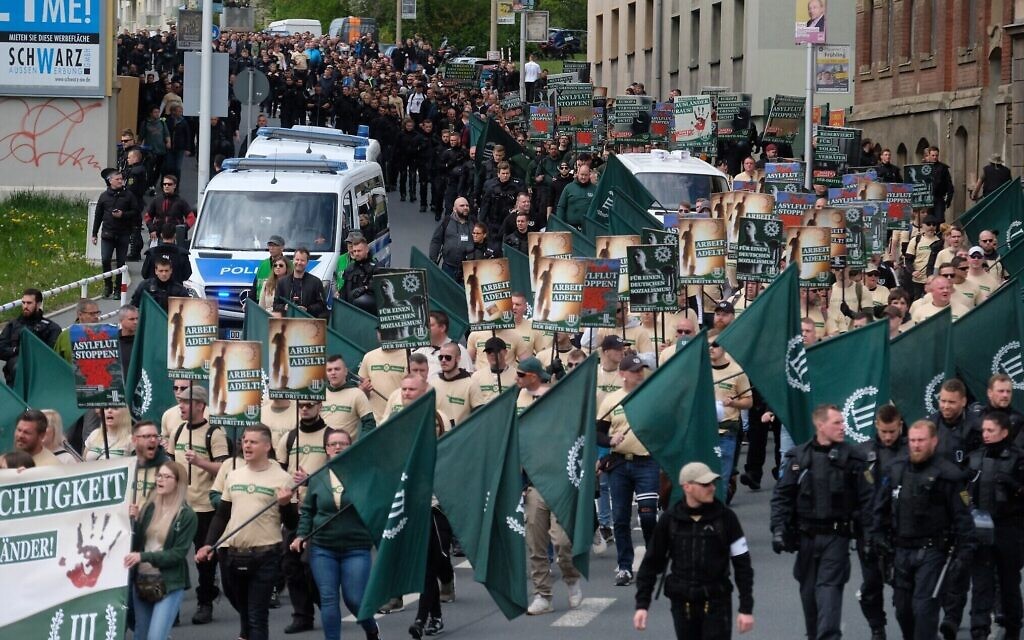 Far-right and neo-Nazi supporters walk through Plauen in eastern Germany, May 1, 2019. (Sebastian Willnow/DPA/AFP via Getty Images/ via JTA) Far-right and neo-Nazi supporters walk through Plauen in eastern Germany, May 1, 2019. (Sebastian Willnow/DPA/AFP via Getty Images/ via JTA)