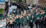 Far-right and neo-Nazi supporters walk through Plauen in eastern Germany, May 1, 2019. (Sebastian Willnow/DPA/AFP via Getty Images/ via JTA)